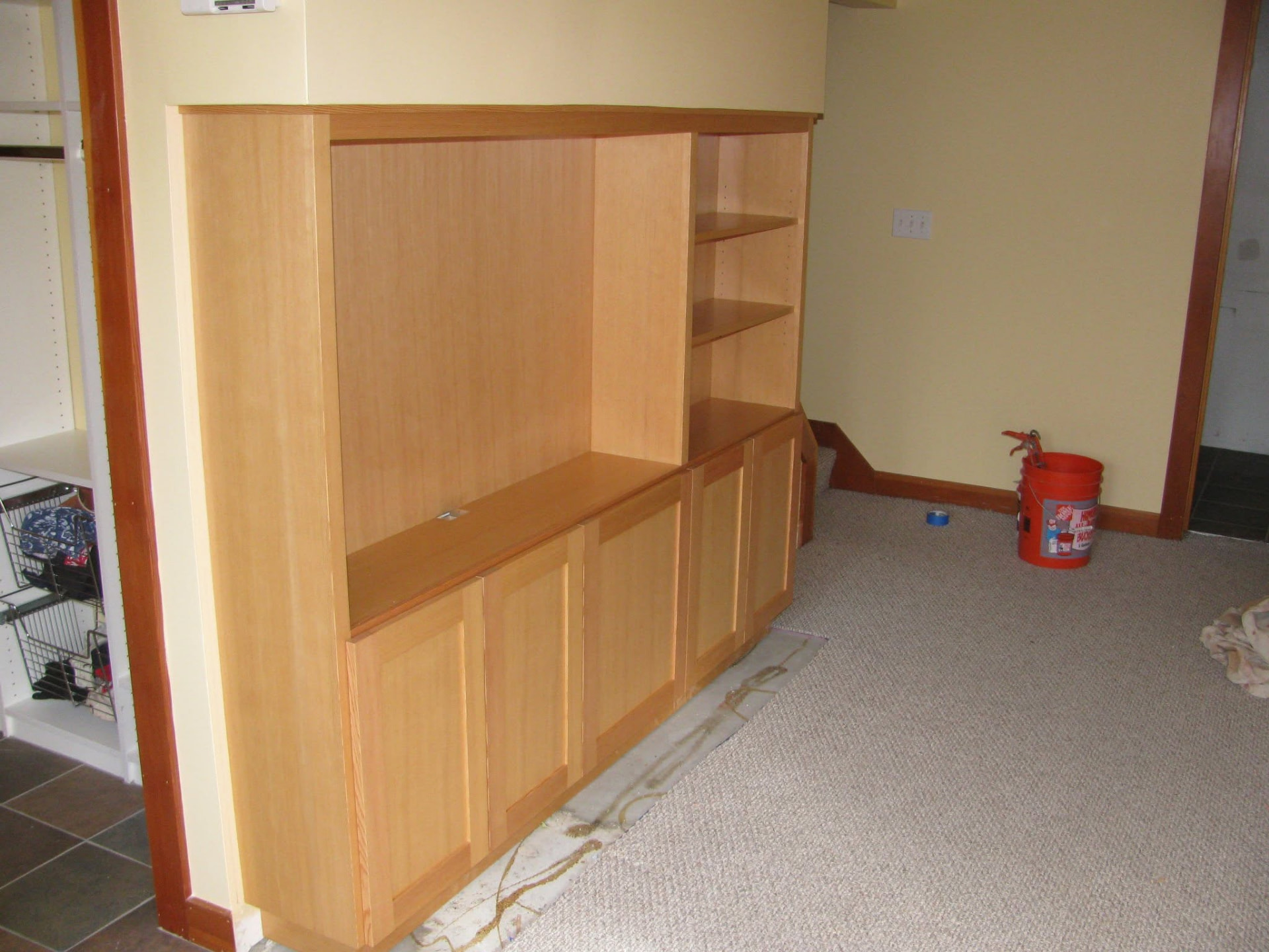 Built-in media cabinet and shelving in vertical grain fir